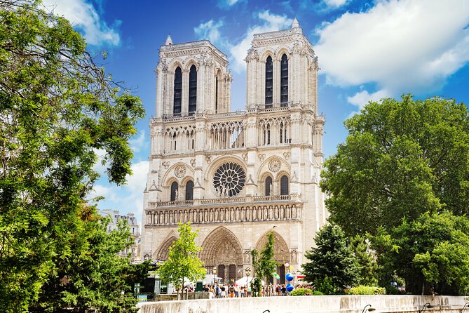 Early Access Paris Notre Dame Cathedral Walking Tour - Square Jean XXIII: Roman-era clues and buttress-photo energy