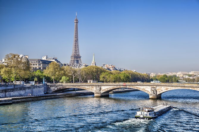 Eiffel Tower Summit Option with Seine River Cruise and City Tour - The Coach City Tour: Audio Commentary and a Lot of Icons