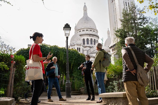 Hidden Montmartre: Paris' Secret Streets Walking Tour - Stop 4: Le Moulin de la Galette, expensive Montmartre houses, and a secret passage