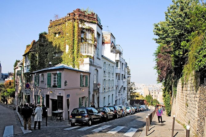 Montmartre Hidden Gems and Scenic Highlights Walking Tour - The wall-walker sculpture near Marcel Aymé: surreal Montmartre