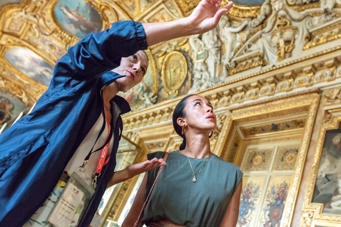 Paris: Louvre Museum Tour Mona Lisa & Iconic Masterpieces - Entering the Louvre pyramid with pre-reserved access