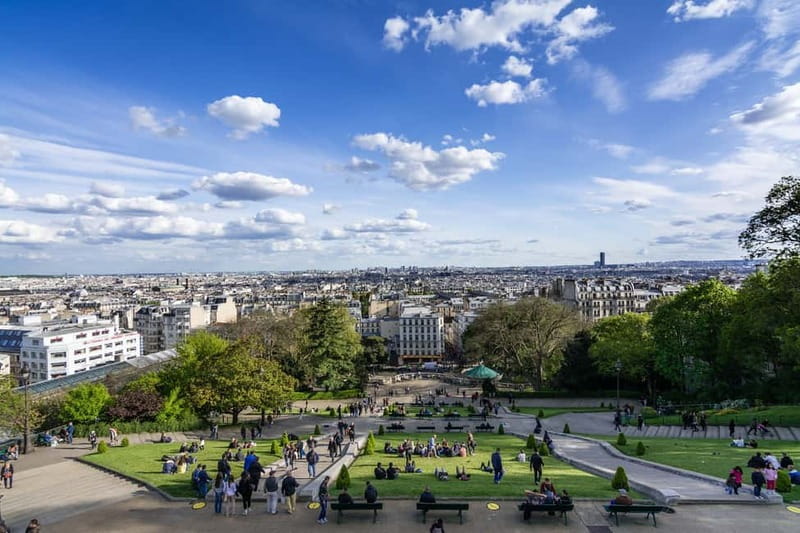 Paris: Montmartre Highlights Walking Tour with a Local Guide - Place Saint-Pierre under Sacré-Cœur: setting the scene from the top